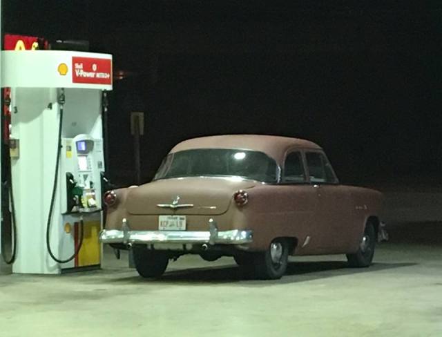 54 Ford gas pump night drive